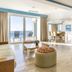Be Live Experience Hamaca Suites in Boca Chica with ocean-view balcony and bright living area