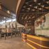 Universal Endless Summer Resort Dockside in Orlando lobby with bar, seating, and modern ceiling design