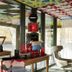citizenM Rome Isola Tiberina lounge with display tables and colorful mirrored ceiling in Rome