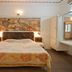 Hotel Chevron International in Ludhiana guest room with double bed, bedside lamps, and wall art