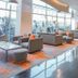 Harris Hotel & Convention Festival Citylink Bandung lobby seating area with large windows and city views