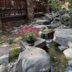 Rock garden stream and flowers at Cottage Inn At Lake Tahoe in Tahoe City