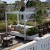 La Palmeraie in La Baule-Escoublac rooftop terrace with cabana seating and potted plants