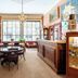 Hôtel de l'Abeille in Orléans: elegant lounge with chandelier, large windows, and antique furnishings