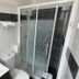 Contact Hôtel les Platanes Villeneuve sur Lot Centre bathroom with shower, sink and toilet in Villeneuve-sur-Lot