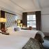 Westhouse Hotel New York guest room with two beds and city-view window in New York