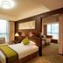Zhehai Hotel Ningbo guest room with twin beds, large windows, and seating area in Ningbo
