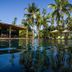 Omali São Tomé poolside with palm trees and tropical garden reflections in São Tomé