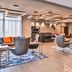 Fairfield Inn and Suites by Marriott Raleigh Cary lobby lounge with seating, TV, and modern lighting in Cary