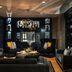 Renaissance Cincinnati Downtown Hotel lounge with dark seating, chandelier, and built-in shelving in Cincinnati