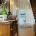 The Langworthy Inn & Winery lobby with staircase, wood furniture, and doorway to outdoor seating