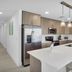 The Avalon Club in Clearwater Beach kitchen with island, stainless steel appliances and pendant lights