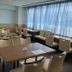 Rihga Royal Hotel Niihama meeting room with tables, chairs and large windows overlooking Niihama