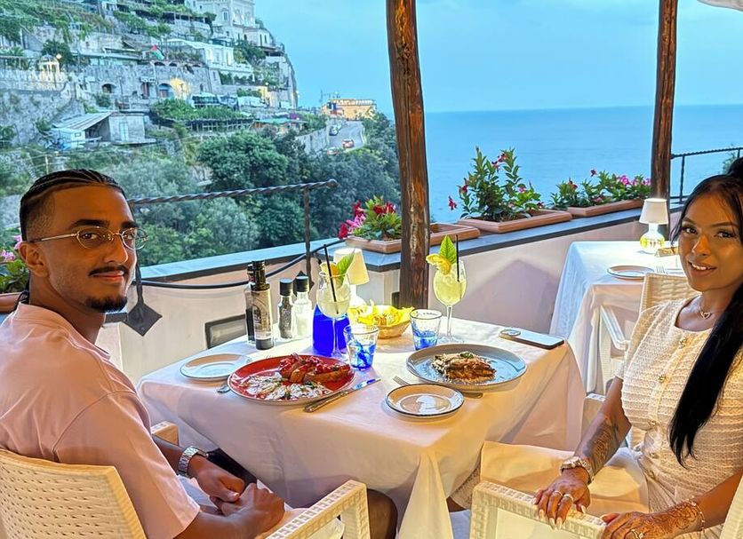 Hotel La Pergola Amalfi terrace dining with sea view and cliffside Amalfi Coast backdrop