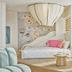 Grand Josun Busan room with whale-shaped ceiling light, mural wall, and yellow lounge chair