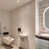 Holiday Inn London - Bloomsbury By IHG bathroom with shower, wall-mounted toilet and sink