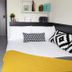 Aparto Dorset Point City Centre Accommodation Dublin room with double bed, desk, shelves and modern decor