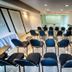 Tri Hotel Centro Chapecó meeting room with rows of blue chairs facing a presentation screen in Chapecó