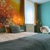 B&B Brasserie Lakerhof room in Ohe en Laak with twin beds, floral mural, teal wall and window light