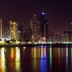 Ramada Plaza Panama Punta Pacifica in Panama City with skyline and colorful water reflections at night