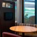 Courtyard by Marriott Nashville Brentwood lobby seating area with round tables and lounge chairs