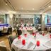 Leonardo Royal Hotel Düsseldorf Königsallee restaurant with round table settings and modern seating in Düsseldorf