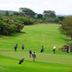Great Rift Valley Lodge and Golf Resort in Naivasha overlooking a lush golf course with players on the fairway
