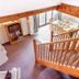 The Grove Cromer, Cromer: loft-style living area with staircase, dining table and balcony doors