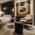 Hotel The Designers Premier Seongsu and Konkuk Univ room in Seoul with bed, chair, round mirror and city view