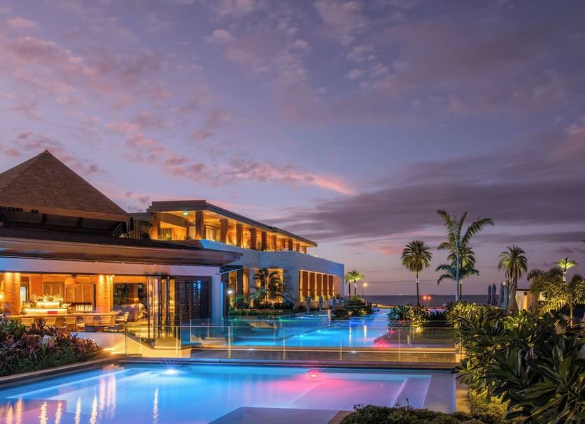 Crowne Plaza Fiji Nadi Bay Resort & Spa By IHG in Nadi with illuminated pools at sunset