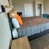 The 409 Bolivar Beach Hotel room with queen bed, desk and wall-mounted TV in Bolivar Peninsula