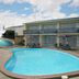 Raceway Motel in Whanganui with outdoor pool and motel rooms overlooking the pool area