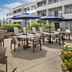 Courtyard by Marriott Chicago Waukegan/Gurnee patio with tables, umbrellas and outdoor seating in Waukegan
