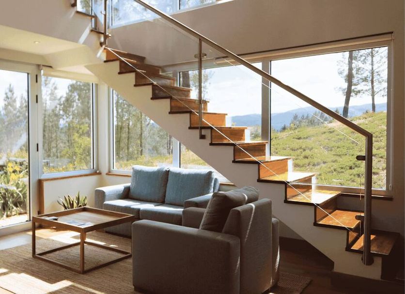 Água Hotels Mondim de Basto lounge with glass staircase and mountain view