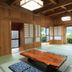 Minshuku Yakusugiso in Yakushima, tatami room with low wooden table and garden-view windows