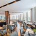 Meliá Ibirapuera in Sao Paulo, bright hotel restaurant with large windows and set dining tables