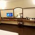 The Citi Inn Jamshedpur room with long desk, chair, wall mirror and TV