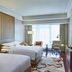 Zhuhai Marriott Hotel in Zhuhai guest room with two beds, floor-to-ceiling window and city view