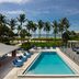 Sanibel Island Beach Resort pool with palm trees and ocean view in Sanibel