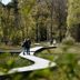 Witte Berken Natuurhotel in Epe with a winding boardwalk through a wooded nature area