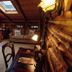 Chalet of Canandaigua cozy log cabin suite with skylight, sofa, and wood-paneled interior in Canandaigua