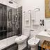 Casa do Bairro by Shiadu bathroom with glass shower, toilet, bidet and vanity in Lisbon