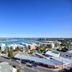 Pumicestone Blue in Caloundra with panoramic coastal views over water and nearby buildings