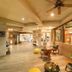 Sinclairs Bayview in Port Blair lobby with wood accents, seating area, and ceiling fans