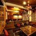 Welcome Hotel at Srinagar lounge with carved wood seating, chandelier and patterned drapes