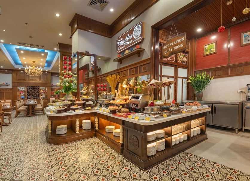 Hanoi Pearl Hotel in Hanoi breakfast buffet with pastries, fruit and dining tables
