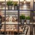 Original Sokos Hotel Kaarle in Kokkola restaurant seating with rustic decor and potted plants