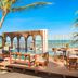 Secrets Tulum Resort And Beach Club in Tulum with oceanfront deck, palm trees, and open-air dining