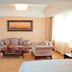 Qilu International Hotel Harbin lounge with sofas, coffee table, and large window light