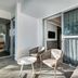 Catalonia Privileged Maroma in Playa del Carmen patio with chairs, table, and sliding glass doors